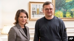 Ukrainian Foreign Minister Dmytro Kuleba, right, and German Foreign Minister Annalena Baerbock, during their meeting in Kyiv, Ukraine, Sept. 10, 2022.