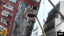 Heavy equipment are being used to demolish the Uranus building, which was damaged in the April 3 earthquake, in Hualien on April 5, 2024. 