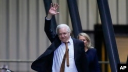 WikiLeaks founder Julian Assange waves after landing at RAAF air base Fairbairn in Canberra, Australia, June 26 2024.