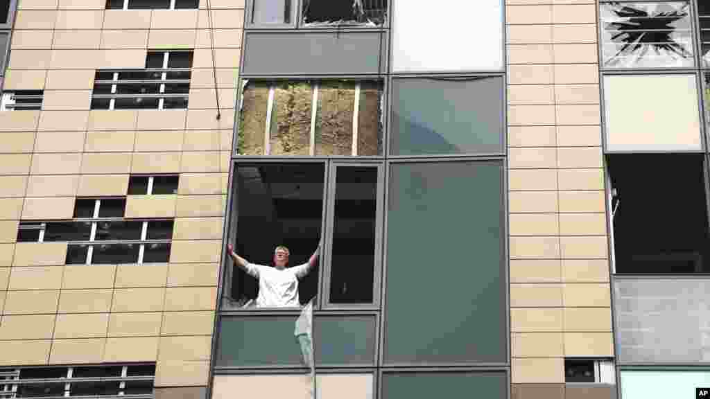 A medical worker looks out from a damaged window after Russian missile hit the country's main children hospital Okhmatdyt in Kyiv, Ukraine, July 8, 2024.