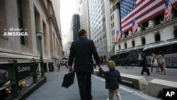 FILE -- A recent survey finds that 77% of respondents prioritize a balanced life over advancement at work.