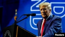 FILE - Former President Donald Trump speaks at the National Rifle Association annual convention in Indianapolis, Indiana, April 14, 2023. 