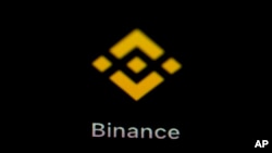 FILE - The Binance app icon is seen on a smartphone, Feb. 28, 2023, in Marple Township, Pa. 