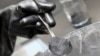 FILE - Graphite powder is pictured in a Volkswagen pilot line for battery cell production in Salzgitter, Germany, May 18, 2022. Beijing in December is set to curb exports of graphite, a key material used in the making of batteries for electric vehicles.