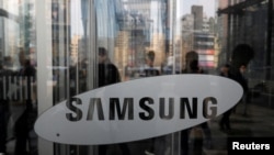 FILE - The logo of Samsung Electronics is seen at its office building in Seoul, South Korea, March 23, 2018. 