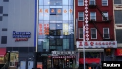 FILE - The former office of the America ChangLe Association, described by U.S. authorities as a Chinese "secret police station," is shown in New York City, April 17, 2023. Several countries around the world routinely repress their critics based in the U.S., a recent report found.