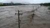 Extreme Rain in Beijing After Typhoon Turns Roads Into Rivers, Kills Two 