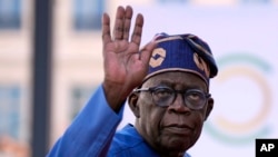 FILE - Nigeria's President Bola Tinubu arrives for the closing session of the New Global Financial Pact Summit, in Paris, on June 23, 2023.