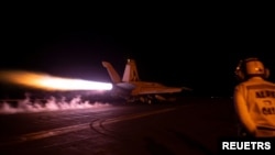 FILE - A fighter jet launches from the U.S. Navy aircraft carrier USS Dwight D. Eisenhower during a strike against Houthi military targets in Yemen, Feb. 3, 2024.