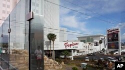 FILE - Reflection near the Tropicana Las Vegas, May 16, 2023, in Las Vegas. A proposal for a new Oakland Athletics ballpark at the Tropicana site, revived debate on stadium funding.