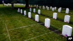 FILE - Headstones are seen at the cemetery of the US Army's Carlisle Barracks, June 10, 2022, in Carlisle, Pa.