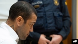 FILE - Brazilian soccer star Dani Alves sits during his trial in Barcelona, Spain, Feb. 5, 2024. Alves has been found guilty on Feb. 22, 2024 of sexually assaulting a young woman in a Barcelona nightclub.