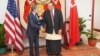 US ..Secretary of State Antony Blinken, left, shakes hands with Tonga Prime Minister Prime Minister Hu‘akavameiliku in Nuku'alofa, Tonga, July 26, 2023.