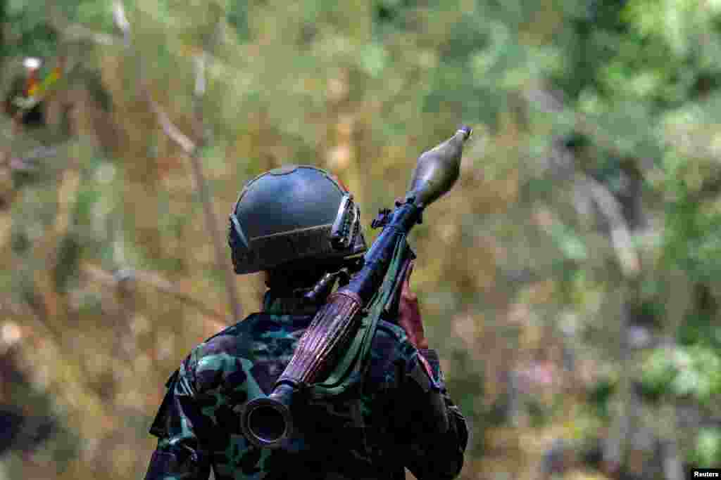 A soldier from the Karen National Liberation Army (KNLA) carries an RPG launcher at a Myanmar military base at Thingyan Nyi Naung village on the outskirts of Myawaddy, the Thailand-Myanmar border town under the control of a coalition of rebel forces led by the Karen National Union, in Myanmar.