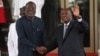 FILE - ECOWAS President Omar Touray, left, greets Ivory Coast President Alassane Ouattara at the ECOWAS emergency summit on the coup in Niger on Aug. 10, 2023, in Abuja, Nigeria.