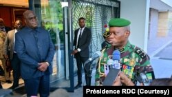 FILE - Gabon's military leader, General Brice Clotaire Oligui Nguema, right, speaks after his meeting with Democratic Republic of the Congo President Felix Tshisekedi, in Kinshasa, Oct. 11, 2023. (DRC Presidency)