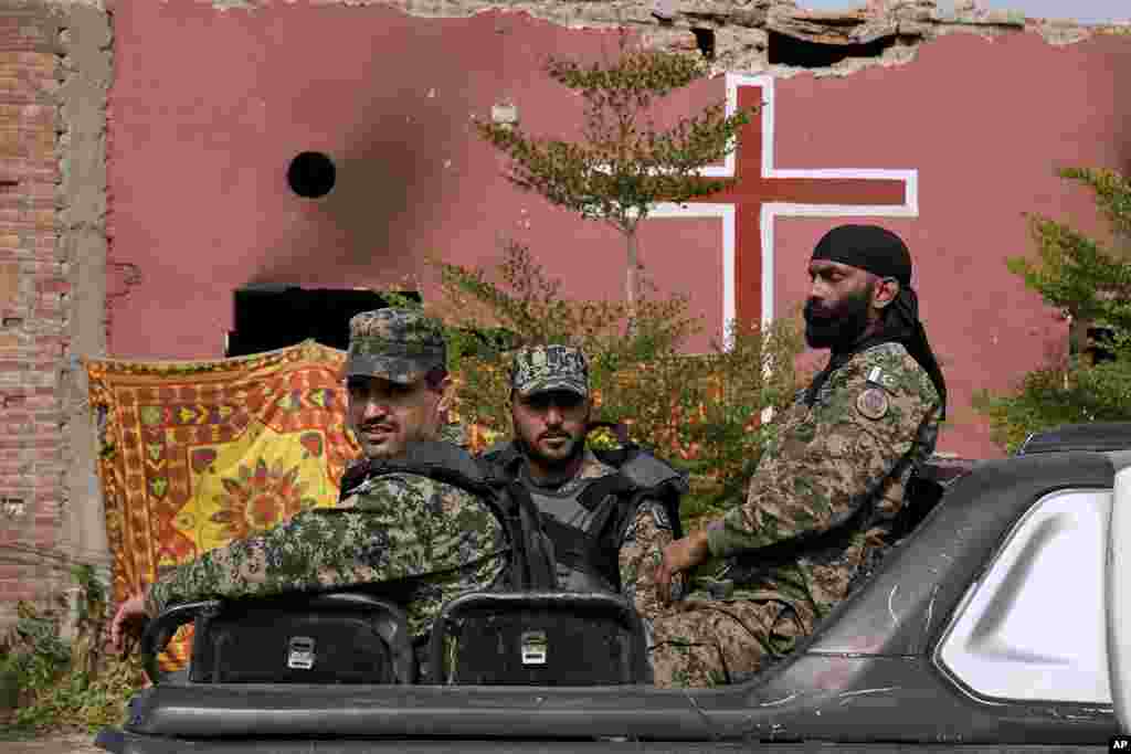 Paramilitary troops stand guard after an angry Muslim mob attacked a Christian area in Pakistan on Aug. 17, 2023.