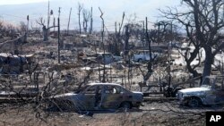 Rumah dan mobil yang hancur di Lahaina, Hawaii, Minggu, 13 Agustus 2023. (AP/Rick Bowmer)