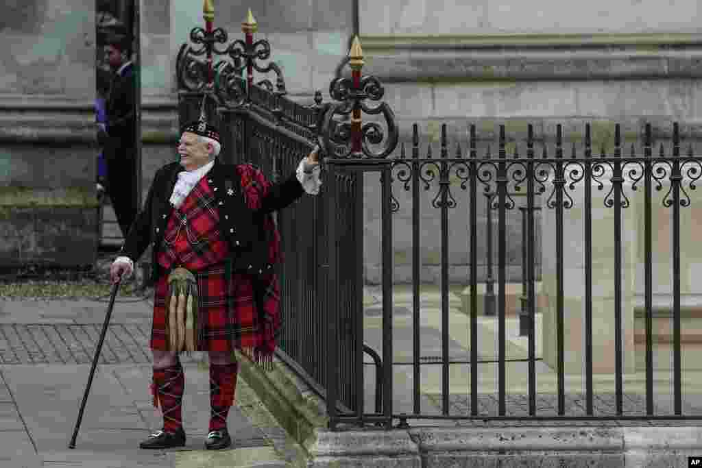 A guest arrives at Westminster Abbey prior to the coronation ceremony of Britain's King Charles III in London, May 6, 2023.