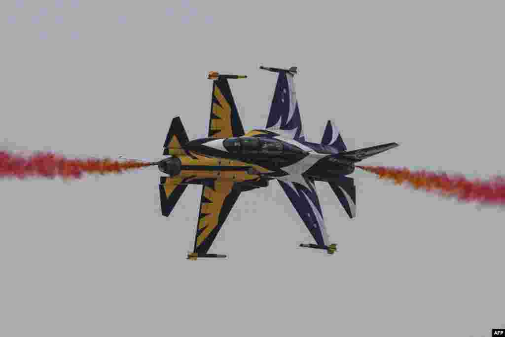 Members of South Korea's Black Eagle aerobatics team perform a display at the Seoul International Aerospace and Defense Exhibition (ADEX) in Seongnam, south of Seoul.