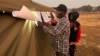 Some voted during the night as voting was extended to a second day Aug. 24, 2023, in Harare, Zimbabwe, after election day was marred by polling station delays and shortages of ballots in opposition strongholds Bulawayo and Harare. (Columbus Mavhunga/VOA)