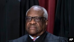 FILE - Associate Justice Clarence Thomas at the Supreme Court building in Washington, Oct. 7, 2022. An investigation by Democratic senators of the court's ethics details Thomas' luxury travel and urges Congress to establish a way to enforce a new code of conduct. 