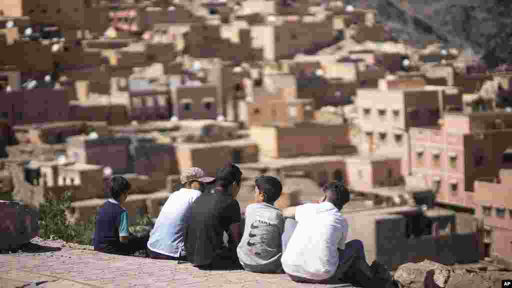 Children look at their home area Moulay Brahim, which was damaged by the earthquake, near Marrakech, Morocco, Sept. 9, 2023.