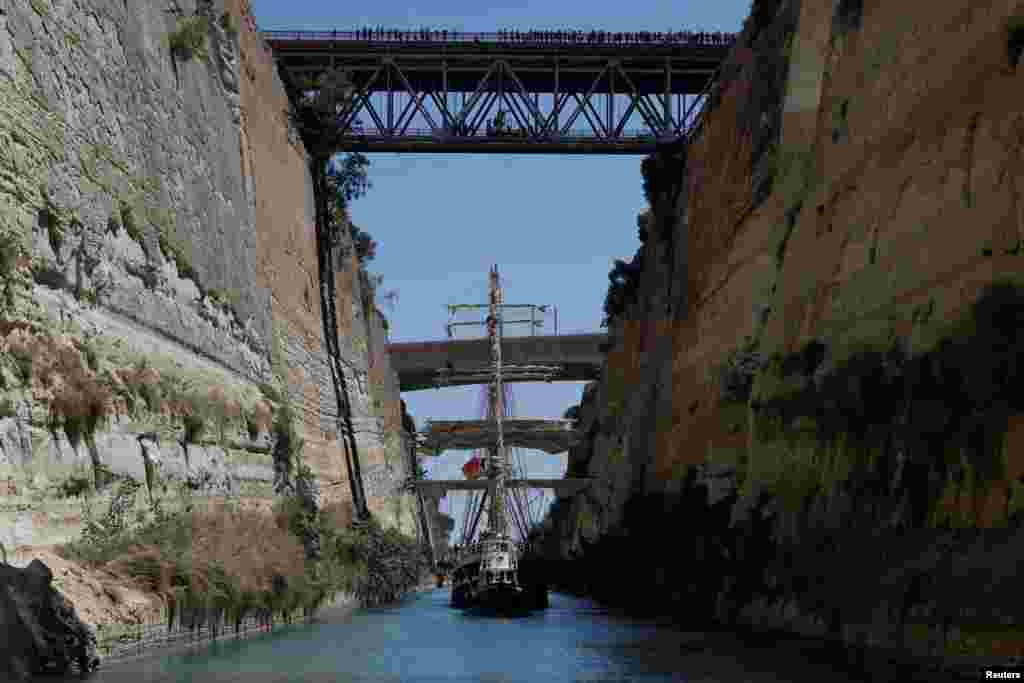 The “Belem”, a three-masted sailing ship that carries the Olympic Flame from Greece to Marseille in France, sails after crossing the Corinth Canal, following the handover ceremony for the Paris 2024 Olympics, in Corinth, Greece.
