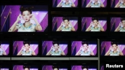 Footages of virtual girl group MAVE is played at the control room of MBC in Seoul, South Korea, February 28, 2023. ( REUTERS/Kim Soo-hyeon)