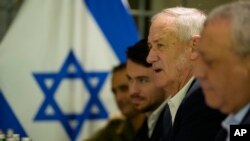 FILE - Former Israeli Defense Minister Benny Gantz, second right, meets with U.S. Secretary of State Antony Blinken in Tel Aviv, Israel, Feb. 8, 2024.