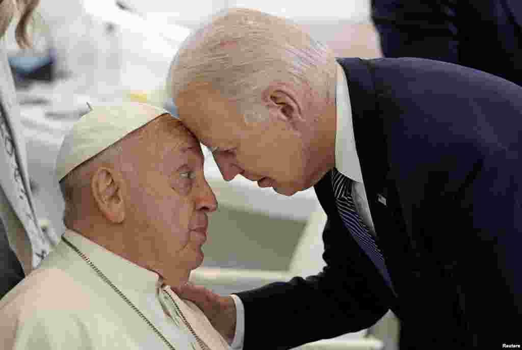 U.S. President Joe Biden and Pope Francis talk ahead of a session on Artificial Intelligence (AI), Energy, Africa and Mediterranean on the second day of the G7 summit in Borgo Egnazia, Italy.