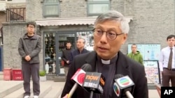 Hong Kong Bishop Stephen Chow talks to media during his visit to Beijing, April 20, 2023, in this image from a video shot by Hong Kong broadcaster TVB.