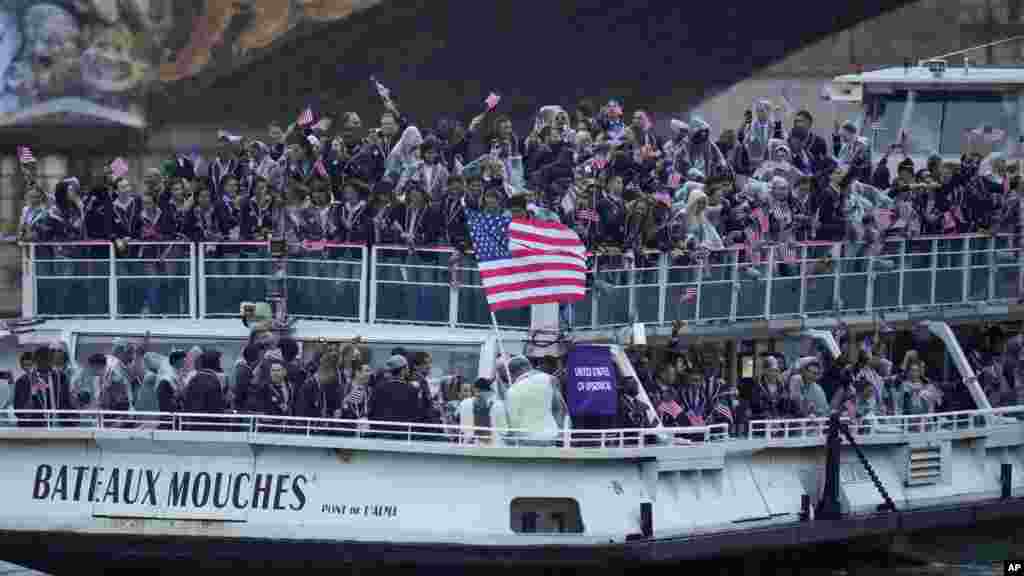 Members of the United States team travel along the Seine River in Paris, during the opening ceremony of the 2024 Summer Olympics, July 26, 2024.