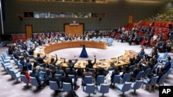 Members of the U.N. Security Council vote to approve its first resolution endorsing a cease-fire plan aimed at ending the eight-month war between Israel and Hamas in Gaza, June 10, 2024, in this photo provided by the United Nations.