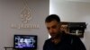 FILE - An employee of Qatar-based news channel Al Jazeera is seen at the media outlet's offices in Jerusalem, July 31, 2017.