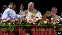 Pope Francis bestows the plenary 'Urbi et Orbi' (to the city and to the world) blessing from the central lodge of the St. Peter's Basilica at the Vatican at the end of the Easter Sunday Mass, April 9, 2023. 