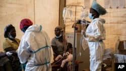 FILE - Health workers treat cholera patients at the Bwaila Hospital in Lilongwe central Malawi on Jan. 11, 2023.