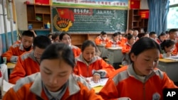 Students attend a Chinese language learning class at Nagqu No. 2 Senior High School, a public boarding school for students from northern Tibet, in Lhasa in western China's Tibet Autonomous Region, June 1, 2021. (AP/Mark Schiefelbein)