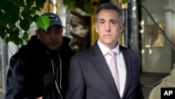 Michael Cohen leaves his apartment building on his way to Manhattan criminal court in New York, May 13, 2024.