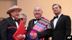 From left, Yancey Red Corn, Chief Standing Bear and Leonardo DiCaprio pose for photographers at the premiere of the film 'Killers of the Flower Moon' at the 76th Cannes international film festival, in Cannes, southern France, May 20, 2023.