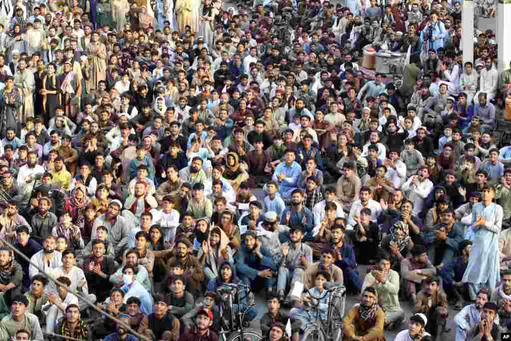 Afghan cricket fans watch the men's T20 World Cup semi final cricket match between Afghanistan and South Africa, on a big screen in the city of Jalalabad, east of Afghanistan.