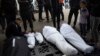 Members of the Abu Draz family mourn their relatives killed in the Israeli bombardment of the Gaza Strip, at a hospital morgue in Rafah, southern Gaza Strip, April 4, 2024.