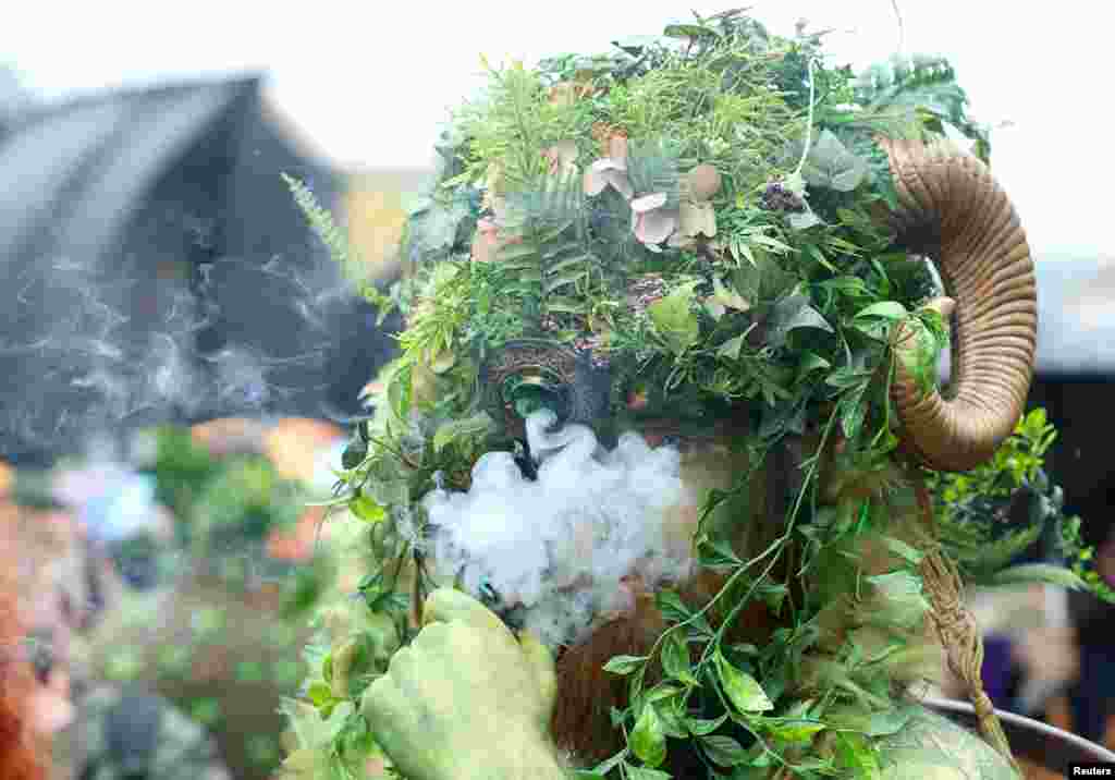 A participant attends the annual May Day bank holiday Jack In The Green parade and festival in Hastings, Britain.