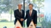In this photo provided by South Korea Presidential Office, Takeo Akiba, left, Japan's National Security Adviser shakes hands with Cho Tae-yong, South Korean National Security Adviser, right, in Seoul, South Korea, May 3, 2023. 