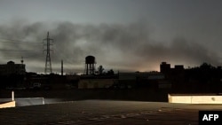 Smoke billows in Khartoum, Sudan, amid fighting between the forces of two rival generals, on May 11, 2023. Almost a month of heavy fighting has turned Khartoum into a war zone.