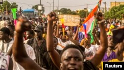 Niger's junta supporters take part in a demonstration in front of a French army base in Niamey, Niger, Aug. 11, 2023.
