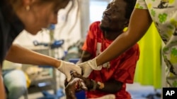 Jean Marc Baptiste is treated for a bullet wound at a Doctors Without Borders emergency room in the Cite Soleil neighborhood of Port-au-Prince, Haiti, April 19, 2024.