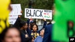 FILE - Hundreds participate in the National Action Network demonstration in response to Gov. Ron DeSantis' rejection of a high school African American history course, Wednesday, Feb. 15, 2023. (Alicia Devine/Tallahassee Democrat via AP, File)