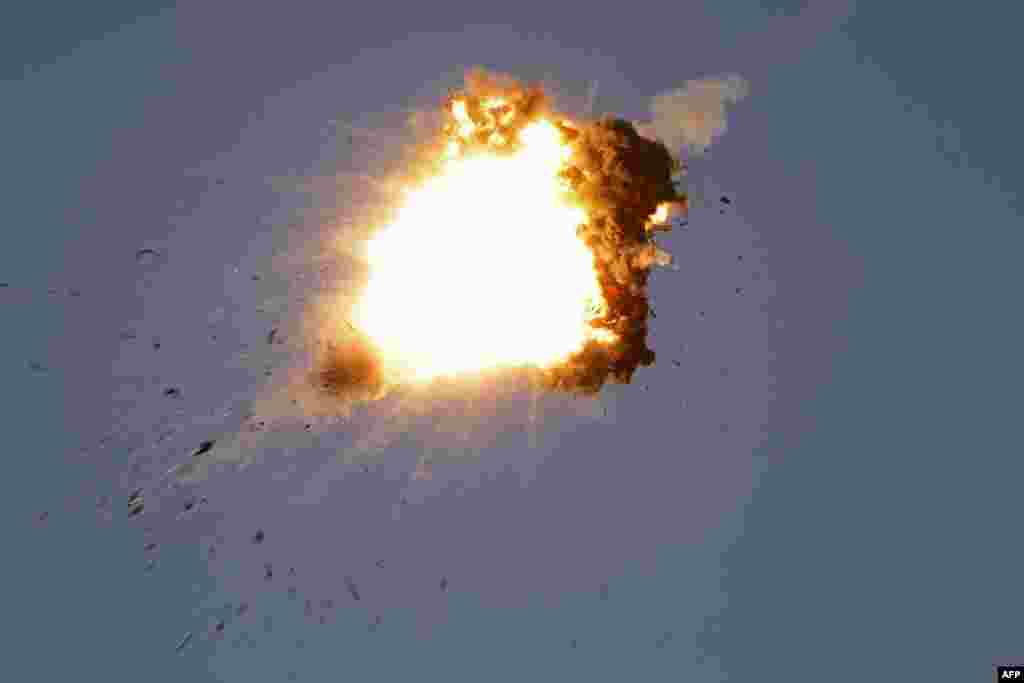 This photo taken from a position in northern Israel shows a Hezbollah UAV intercepted by Israeli air forces over north Israel. The Israeli military announced that it was conducting pre-emptive strikes in Lebanon after detecting preparations for "large-scale" attacks by the Iran-backed militant group Hezbollah. 