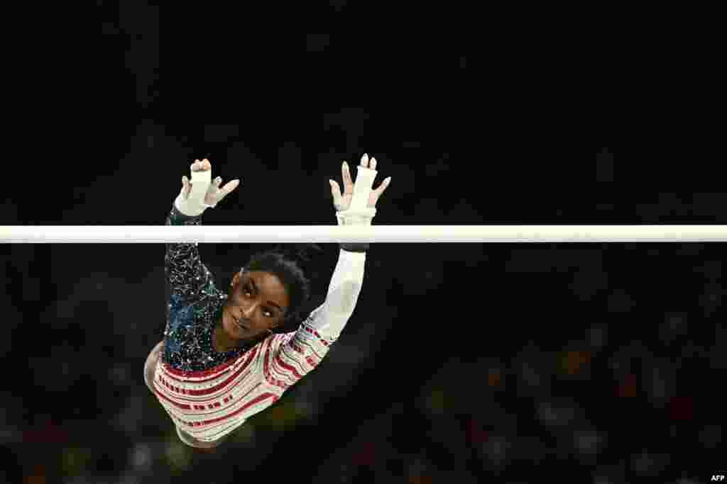 Simone Biles of the United States competes in the uneven bars event of the artistic gymnastics women's team final during the Paris 2024 Olympic Games at the Bercy Arena in Paris, France.